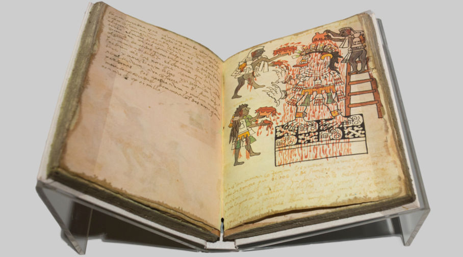 Fotografia de um códice, espécie antiga de livro, em suporte e superfície claros