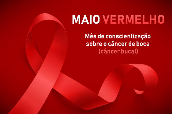 Fita vermelha ao lado do escrito “Maio Vermelho - Mês de conscientização sobre o câncer de boca (câncer bucal). Fita vermelha ao lado do escrito “Maio Vermelho - Mês de conscientização sobre o câncer de boca (câncer bucal).
