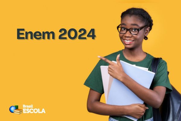 Estudante negra aponta para o texto Enem 2024